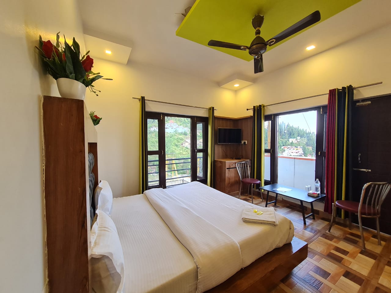 Spacious guestroom opening onto a private balcony.